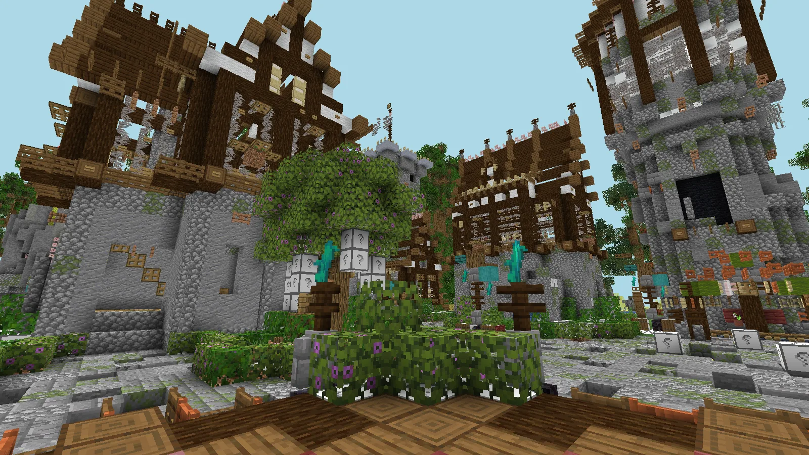 Upward view across stone and timber hub buildings